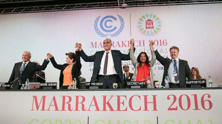 U.N. climate chief Patricia Espinosa, 2nd left, and Morocco's Foreign Minister Salaheddine Mezouar, centre, celebrate after the proclamation of Marrakech, at the COP22 climate change conference, in Marrakech, Morocco, 17 November 2016.