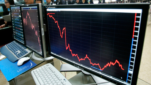 How will the global economy respond to the recent halving of oil prices? (PA)