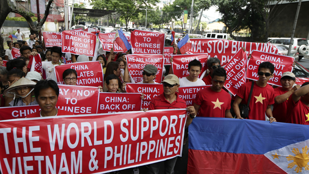 Filipinos and Vietnamese expatriates protest against Chinese ‘bullying’ in the Philippine city of Makati. (PA)