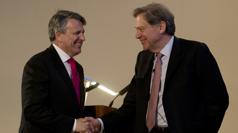 Shell CEO Ben van Beurden (left) shakes on the deal with BG Chairman Andrew Gould in April. (PA)