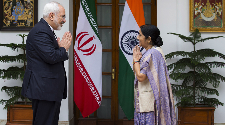 Indian Foreign Minister Sushma Swaraj (right) greets her Iranian counterpart Mohammad Javad Zarif last month. (PA)