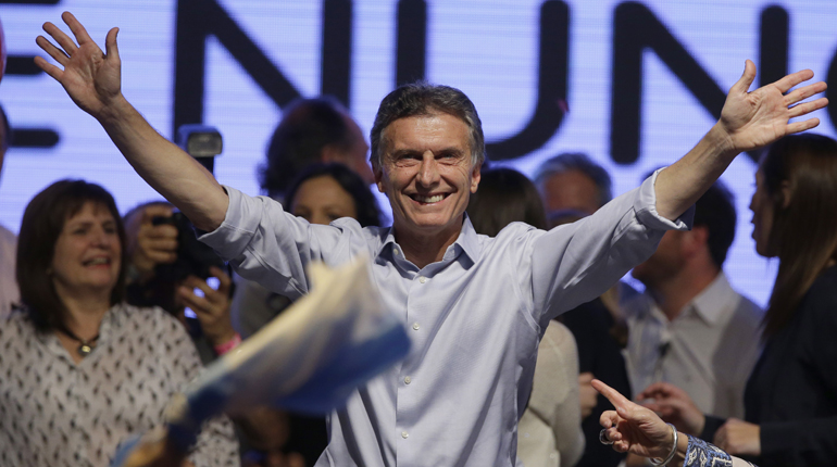 Argentine presidential candidate Mauricio Macri celebrates after forcing a run-off in the country’s election. (PA)