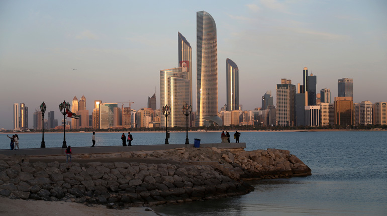 The Abu Dhabi skyline. The emirate is attempting to increase production from its offshore acreage. (PA)
