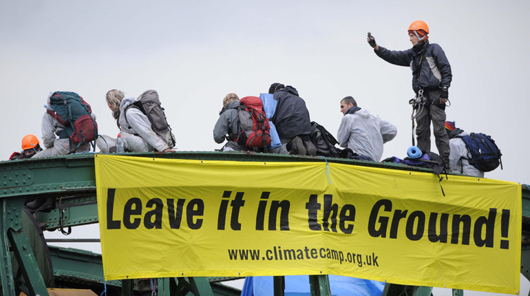 Protesters on top of a coal train bound for the UK’s Drax power station in 2008. (PA)