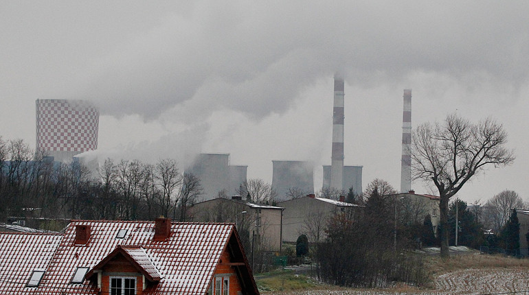 In this Nov. 21, 2018 photo smoke billows from chimney stacks of the heating and power plant in Bedzin, near Katowice, southern Poland. Katowice, in the southern coal mining region, will host global climate summit Dec.2-14.
