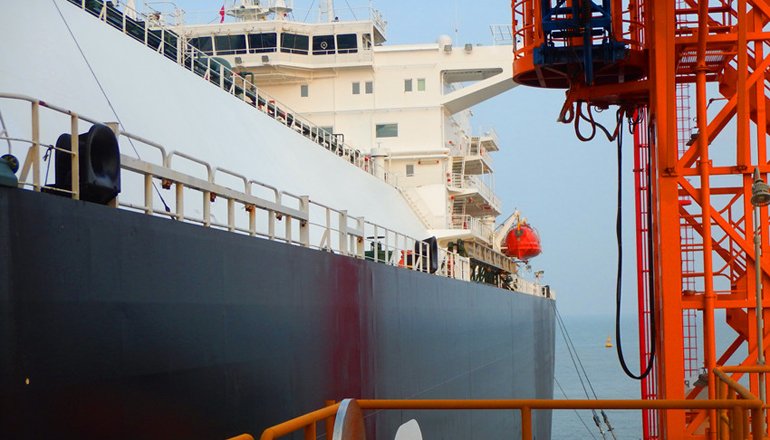 A tanker docked at a Guanghui Energy terminal