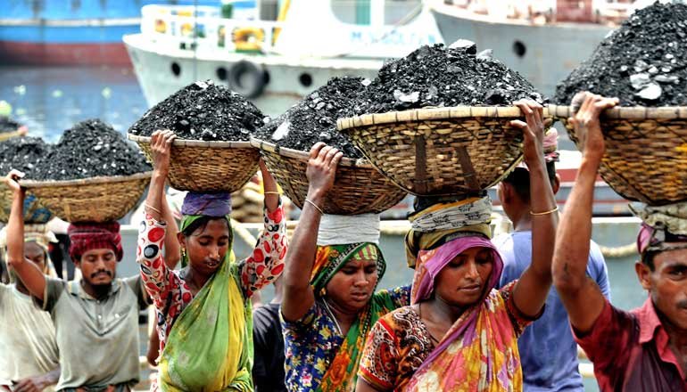 People in Bangladesh carrying baskets of coal.