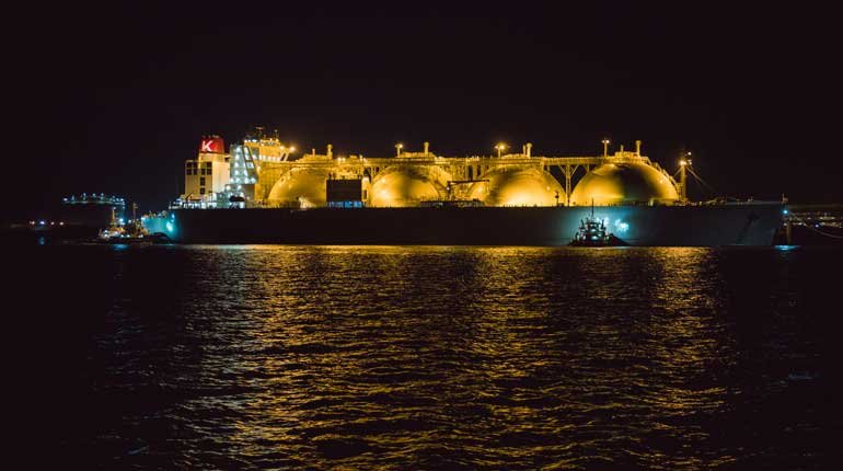 An illuminated LNG tanker