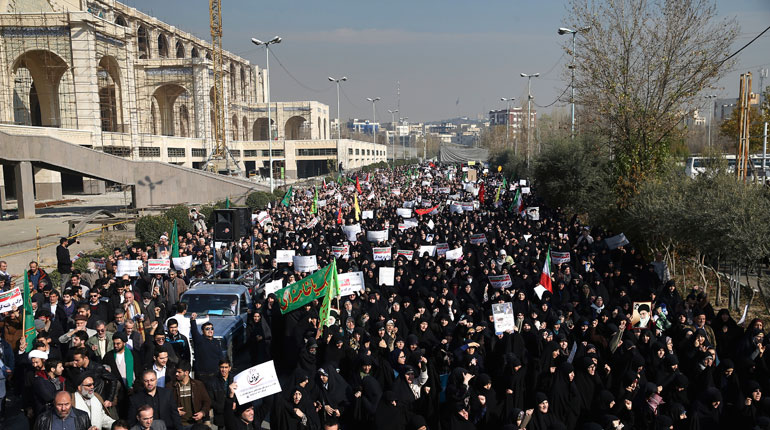 Iranian protesters in Tehran on Saturday. (PA)