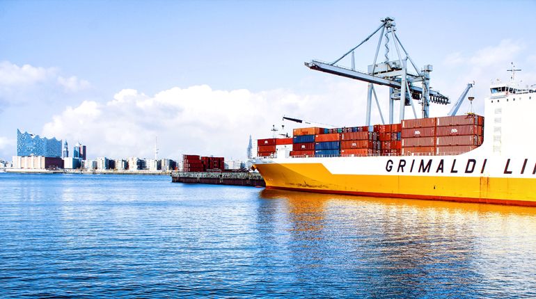 Large shipping containers on a cargo ship in a port