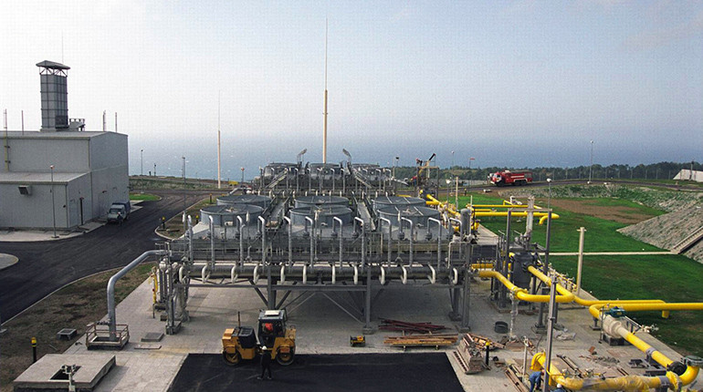 A gas flare beside pumpjacks pumping crude oil at a facility in North Dakota.